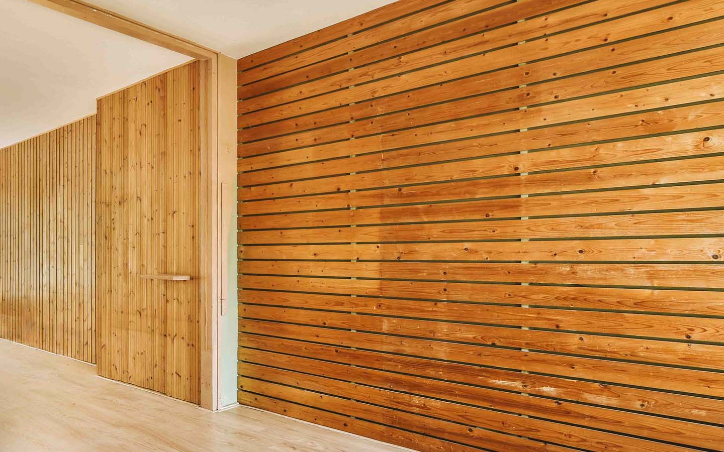 Bild von den Leistungen, abgebildet ist eine Holzfassade